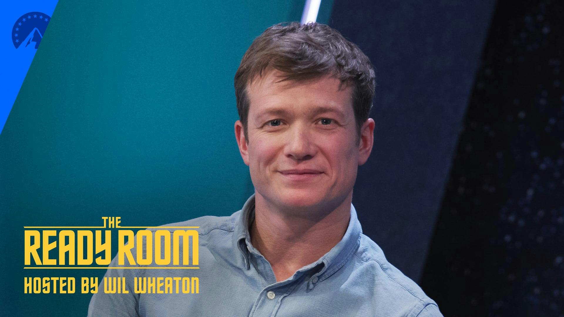 Ed Speleers, smiling, on the set of The Ready Room